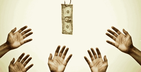 Hands grabbing at a one dollar bill on a hook