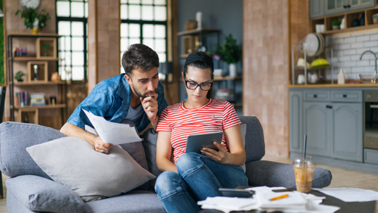 couple reviewing documents at home